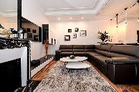 sleek and beautiful lightings in both living and dining area in a 2-bedroom Paris luxury apartment