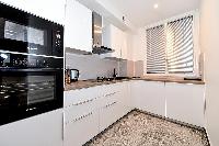 fully-equipped kitchen in a 2-bedroom Paris luxury apartment