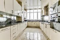 modern fully-equipped kitchen in a 4-bedroom Paris luxury apartment