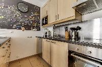 fully equipped kitchen in a Paris luxury apartment