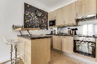 fully equipped kitchen in a Paris luxury apartment