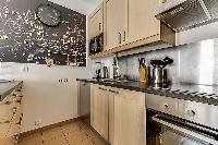 fully equipped kitchen in a Paris luxury apartment