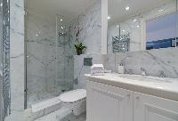 bathroom with marble lavatory, shower, and toilet in a 5-bedroom paris luxury apartment