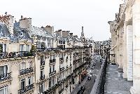 view from the balcony overlooking the city in paris luxury apartment