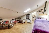 third bedroom on the attic with a double bed, a study or work space