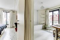 master bedroom and en suite bathroom in a 4-bedroom Paris luxury apartment